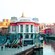 The facade of Erribera Market, a historic riverside market with large windows and a central dome in Bilbao, Spain